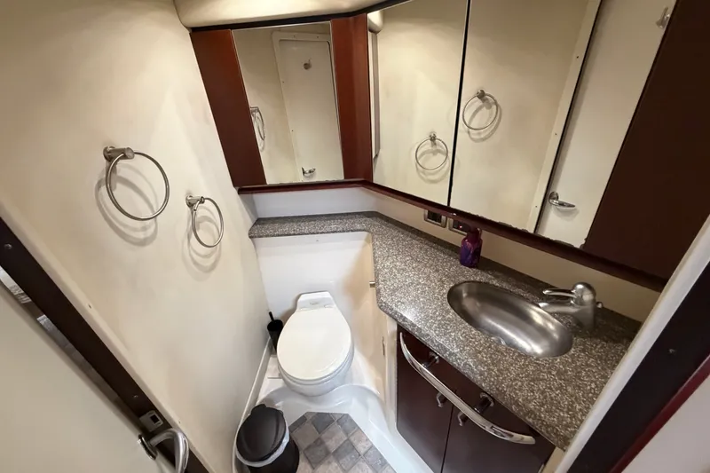 Slide: The Image of Luxurious bathroom in 2006 Sea Ray 550 Sedan Bridge yacht with granite countertop. - 139