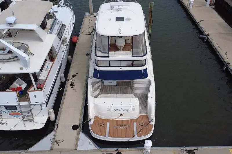 Slide: The Image of Aerial view of a 2006 Sea Ray 550 Sedan Bridge yacht docked at a marina. - 5