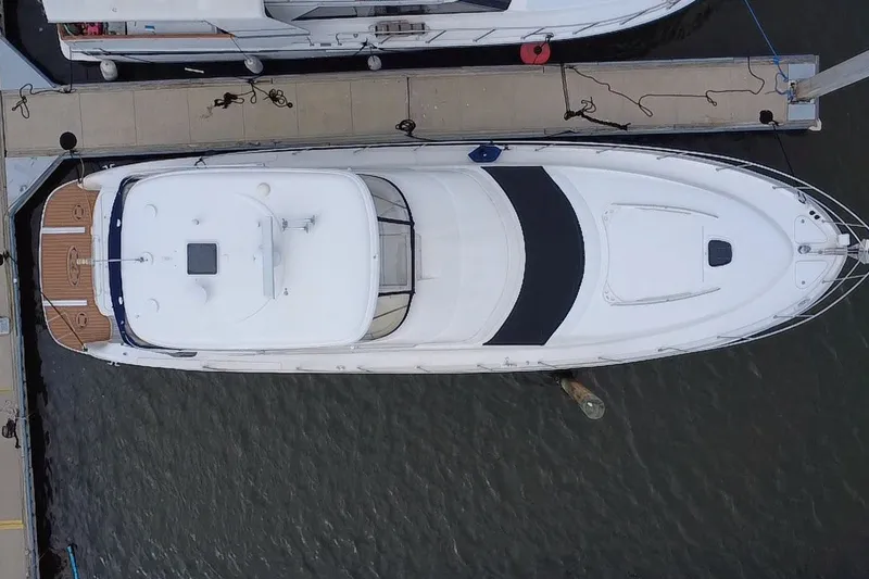 Slide: The Image of Aerial view of a 2006 Sea Ray 550 Sedan Bridge yacht docked at a marina. - 3