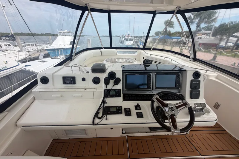 Slide: The Image of Helm of 2006 Sea Ray 550 Sedan Bridge yacht with navigation equipment and steering wheel. - 51