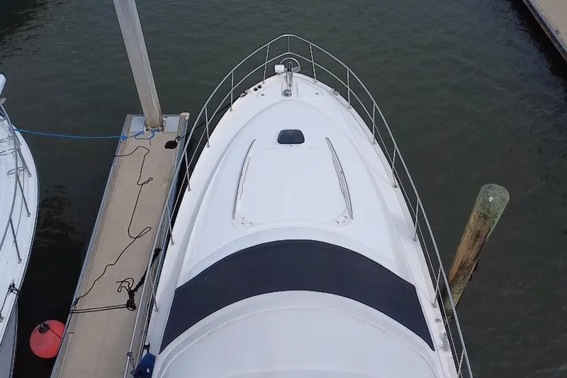 Slide: The Image of Top view of a 2006 Sea Ray 550 Sedan Bridge yacht docked at a marina. - 28