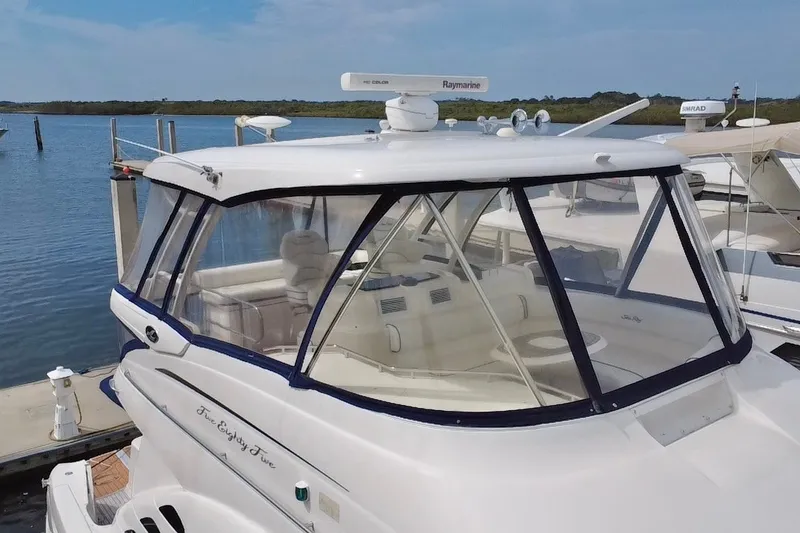 Slide: The Image of 2006 Sea Ray 550 Sedan Bridge yacht docked at marina with clear skies. - 17