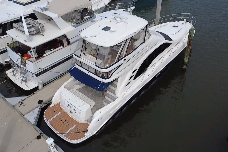 Slide: The Image of 2006 Sea Ray 550 Sedan Bridge yacht docked at marina, aerial view. - 4