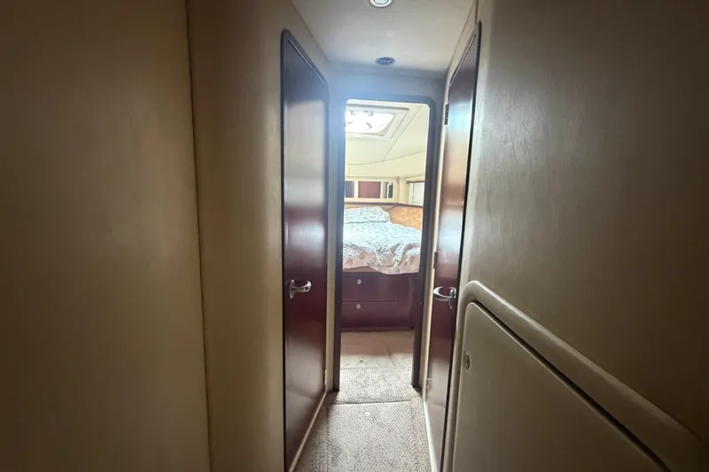 Slide: The Image of Interior hallway view of 2006 Sea Ray 550 Sedan Bridge yacht cabin. - 102