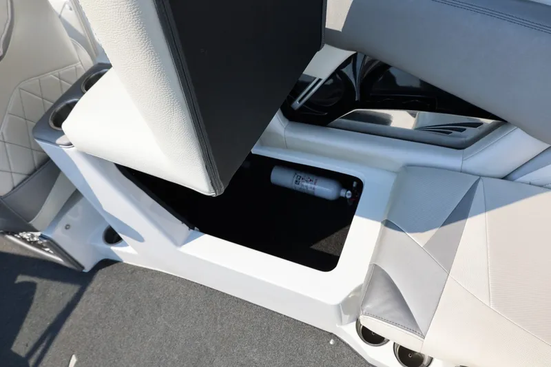 Slide: The Image of 2013 Tigé Z3 boat interior storage compartment with fire extinguisher. - 32