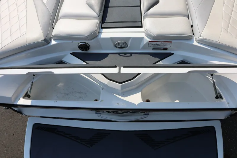 Slide: The Image of Interior view of a 2013 Tigé Z3 boat with open storage compartments. - 14