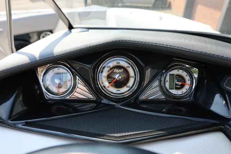 Slide: The Image of Dashboard of a 2013 Tigé Z3 boat with speedometer and gauges. - 43
