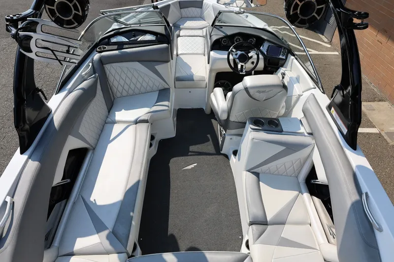 Slide: The Image of Interior of a 2013 Tigé Z3 boat with luxurious seating and modern dashboard. - 21