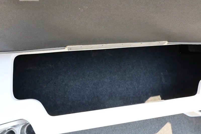 Slide: The Image of Storage compartment in a 2013 Tigé Z3 boat, featuring a spacious interior. - 33