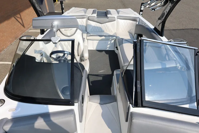 Slide: The Image of 2013 Tigé Z3 boat interior with sleek seating and modern dashboard design. - 52