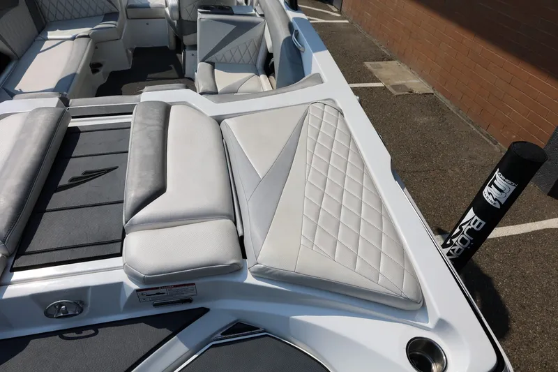Slide: The Image of 2013 Tigé Z3 boat interior with white and gray cushioned seating. - 15