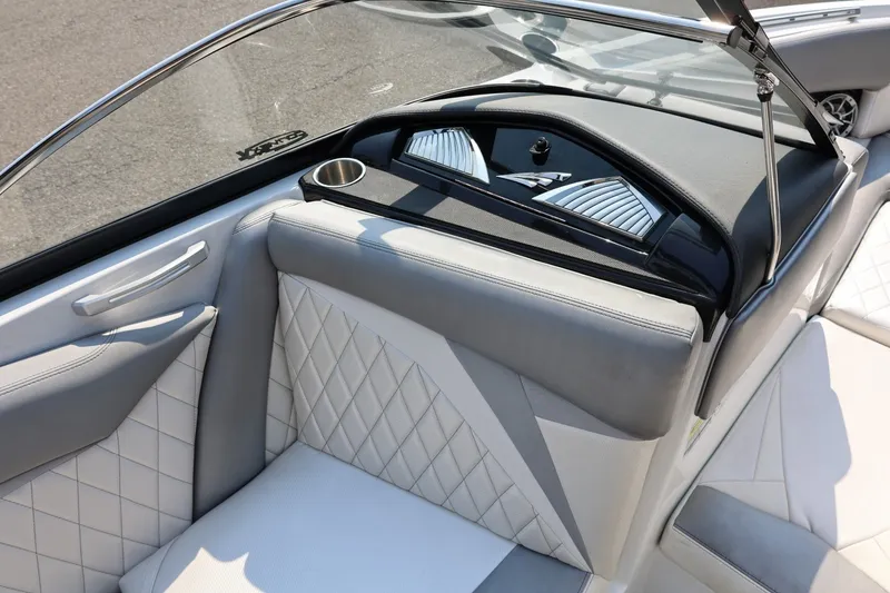 Slide: The Image of Interior of a 2013 Tigé Z3 boat with quilted seats and sleek dashboard design. - 36