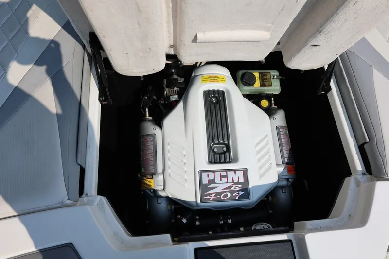 Slide: The Image of Engine compartment of a 2013 Tigé Z3 boat featuring a PCM ZR 409 engine. - 24