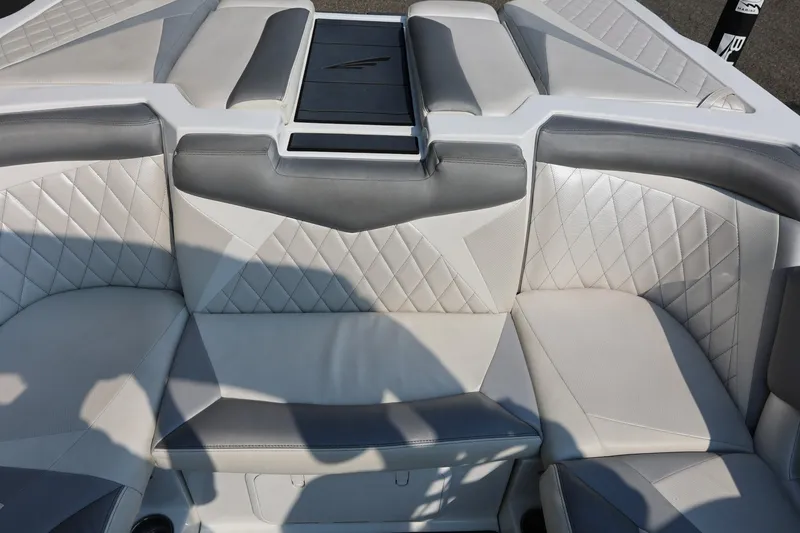 Slide: The Image of 2013 Tigé Z3 boat interior with gray and white diamond-stitched upholstery. - 29