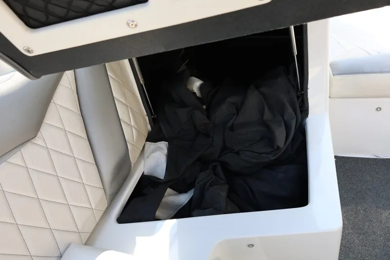 Slide: The Image of Storage compartment in a 2013 Tigé Z3 boat with quilted upholstery. - 35