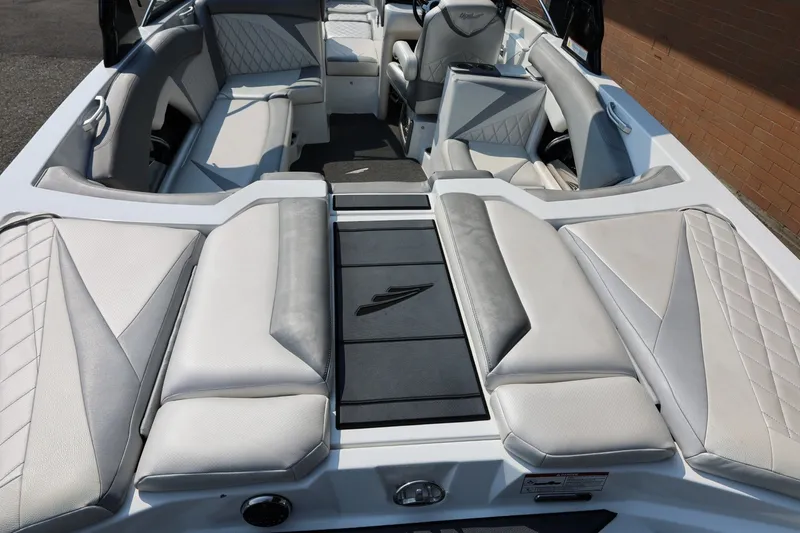 Slide: The Image of 2013 Tigé Z3 boat interior with luxurious seating and modern design. - 19
