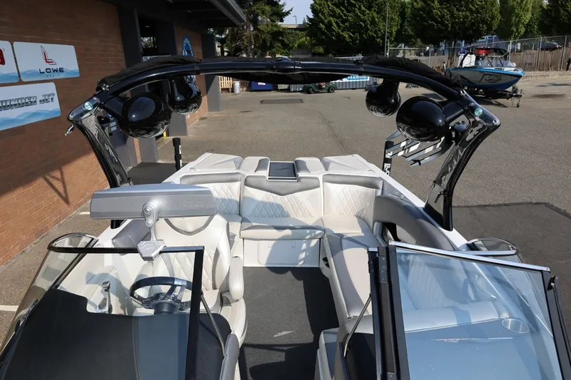 Slide: The Image of 2013 Tigé Z3 boat interior with sleek seating and advanced audio system. - 53