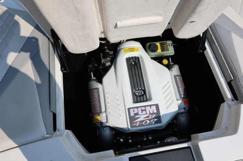 Slide: The Image of Engine compartment of a 2013 Tigé Z3 boat featuring a PCM ZR 409 engine. - 25