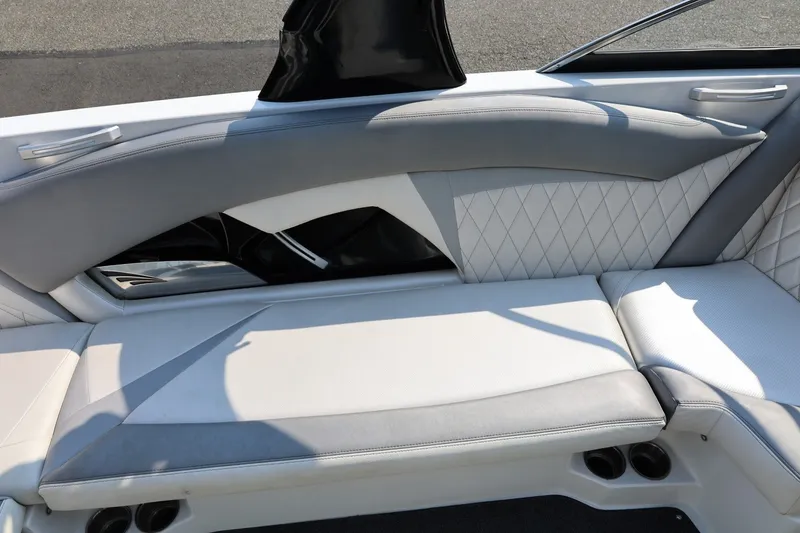 Slide: The Image of 2013 Tigé Z3 boat interior with gray and white diamond-stitched seating. - 27