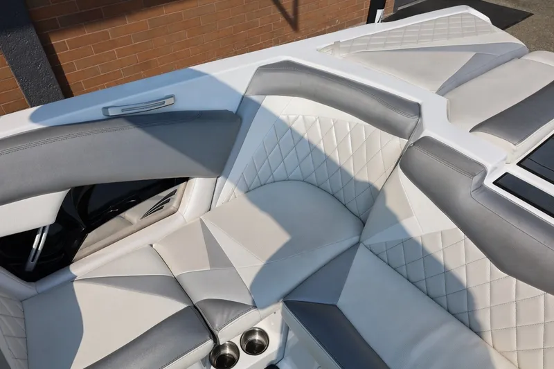 Slide: The Image of 2013 Tigé Z3 boat interior with gray and white quilted seating. - 30