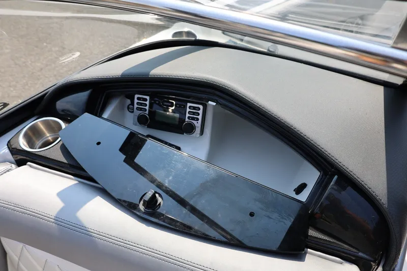 Slide: The Image of Dashboard of a 2013 Tigé Z3 boat with stereo system and cup holder. - 37