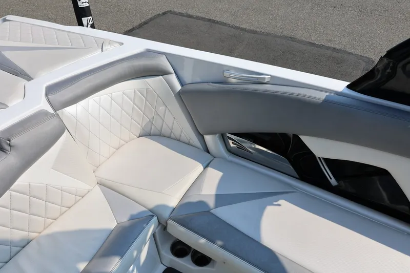 Slide: The Image of 2013 Tigé Z3 boat interior with white and gray cushioned seating. - 28