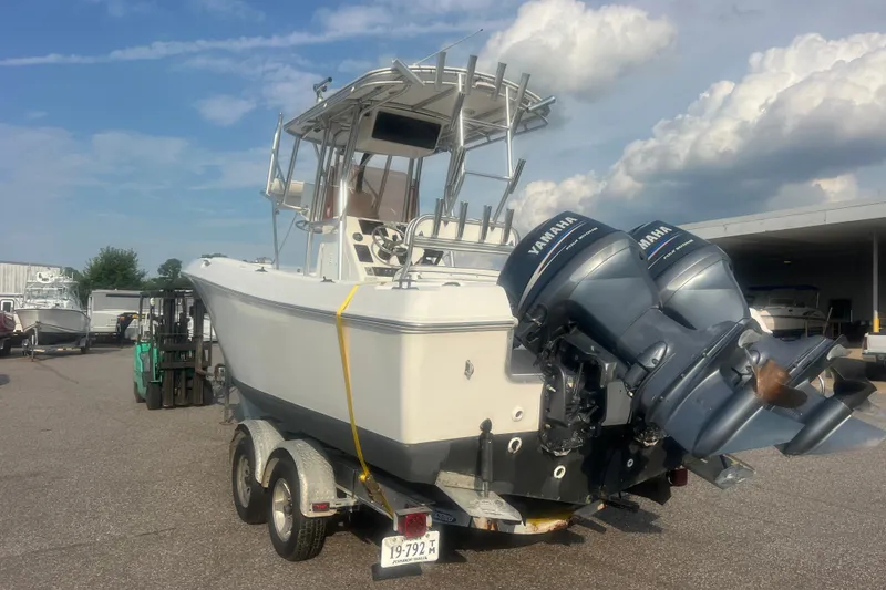 Slide: The Image of 2007 Clearwater 2300 Center Console boat with dual Yamaha engines on a trailer. - 6