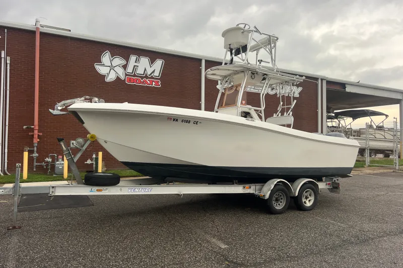 The Image of 2007 Clearwater 2300 Center Console boat on trailer outside HM Boats building. - 0