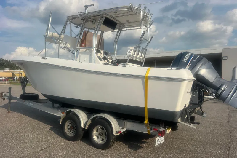 Slide: The Image of 2007 Clearwater 2300 Center Console boat on trailer with Yamaha outboard motor. - 7