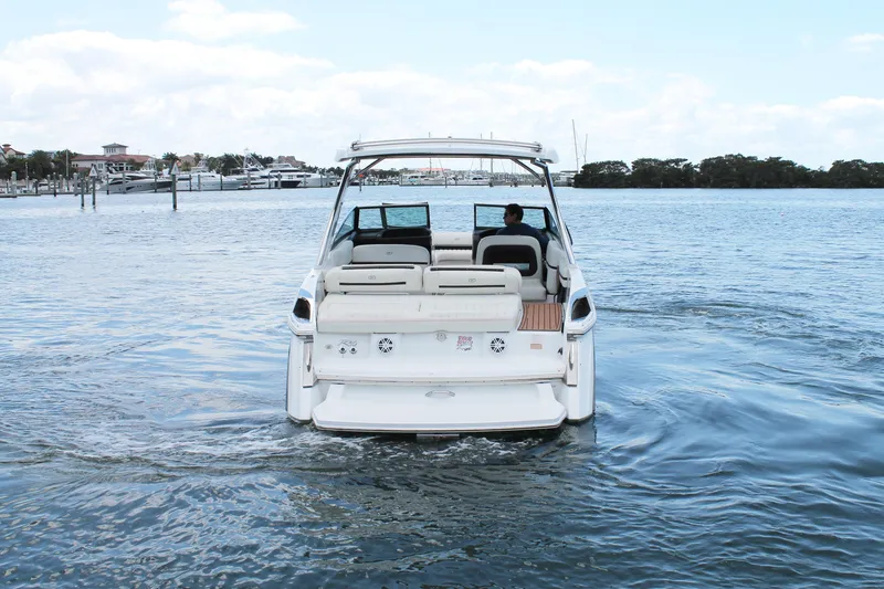 Slide: The Image of 2017 Cobalt R30 boat cruising on a calm waterway. - 9
