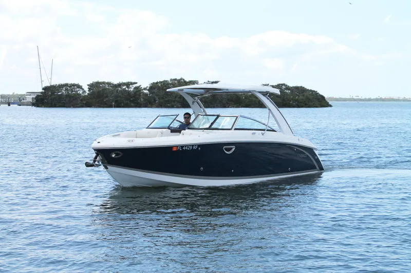 Slide: The Image of 2017 Cobalt R30 boat cruising on calm waters under a clear sky. - 4