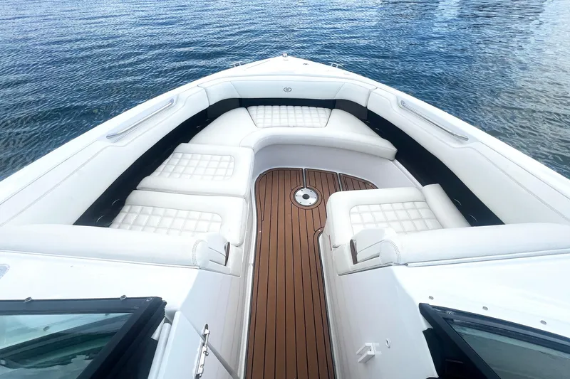 Slide: The Image of Luxurious 2017 Cobalt R30 boat interior with white seating and wooden deck. - 19