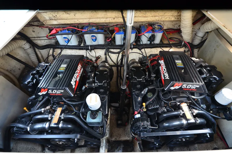Slide: The Image of Engine compartment of a 2002 Rinker Fiesta Vee 310 with twin Mercury 5.0L engines. - 17
