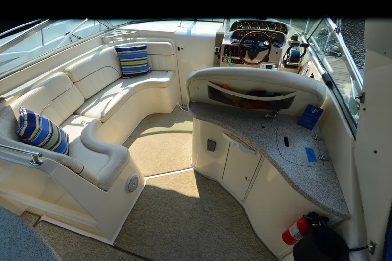 Slide: The Image of Interior of 2002 Rinker Fiesta Vee 310 boat with seating and helm. - 16