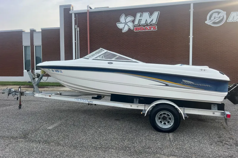 Slide: The Image of 2002 Chaparral 180 SSe boat on trailer outside HM Boats building. - 31