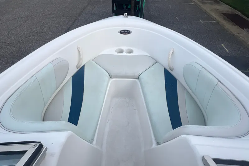 Slide: The Image of 2002 Chaparral 180 SSe boat interior with white and blue seating. - 43