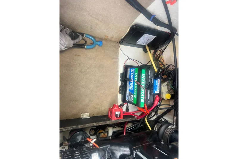 Slide: The Image of Engine compartment of a 2002 Chaparral 180 SSe boat with Interstate battery. - 53