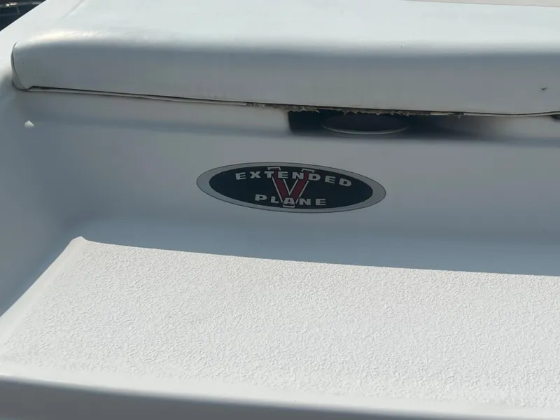 Slide: The Image of Close-up of a white boat section with an "Extended V Plane" logo. - 30