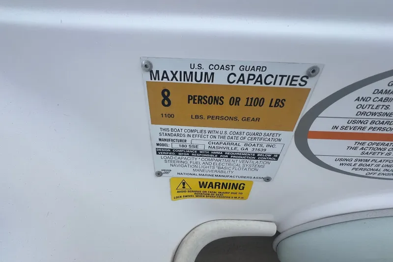 Slide: The Image of 2002 Chaparral 180 SSe boat capacity label, maximum 8 persons or 1100 lbs. - 46