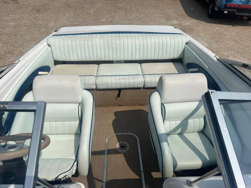 Slide: The Image of Interior view of a 2002 Chaparral 180 SSe with white seating and steering wheel. - 14