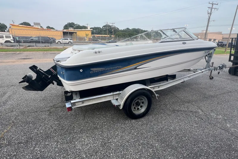 Slide: The Image of 2002 Chaparral 180 SSe boat on trailer, parked outdoors, side view. - 34