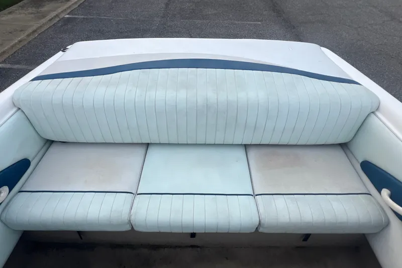 Slide: The Image of 2002 Chaparral 180 SSe boat interior with white and blue cushioned seating. - 50