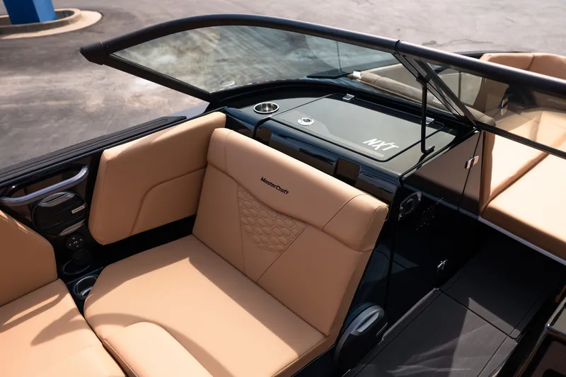 Slide: The Image of Luxurious interior of 2027 MasterCraft NXT24 boat with tan leather seating. - 32