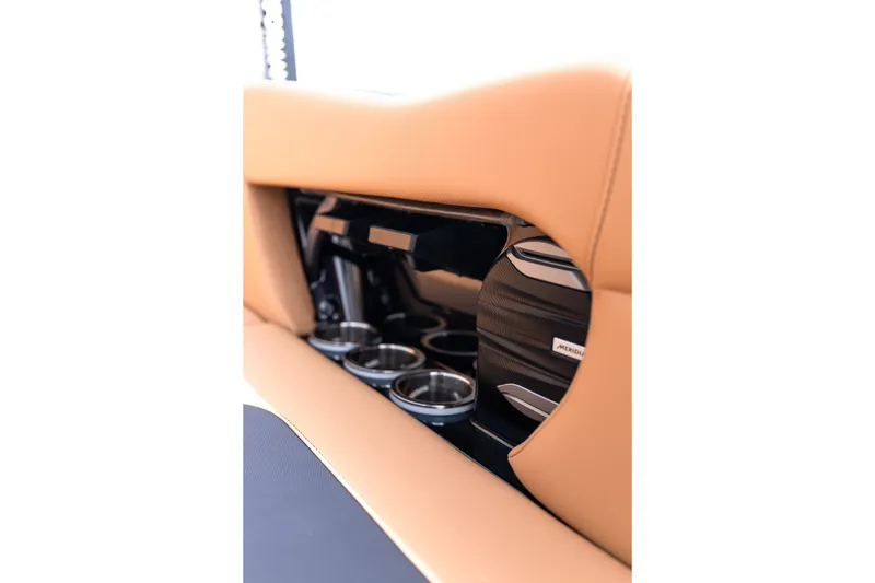 Slide: The Image of Interior detail of 2027 MasterCraft NXT24 boat with cup holders and speaker system. - 34