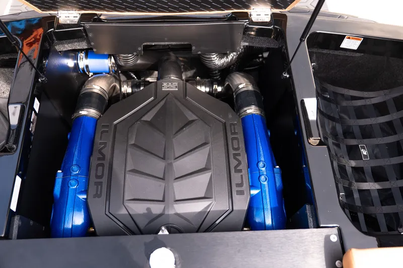 Slide: The Image of 2027 MasterCraft NXT24 engine compartment featuring Ilmor engine components. - 38