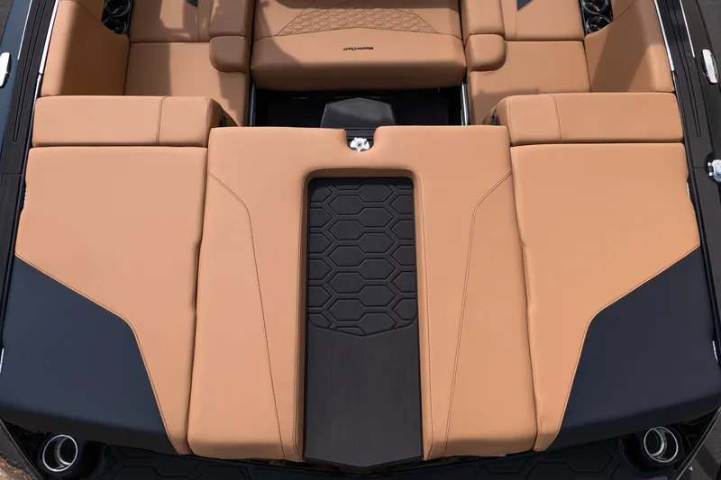 Slide: The Image of Luxurious seating of 2027 MasterCraft NXT24 boat with tan upholstery and modern design. - 37
