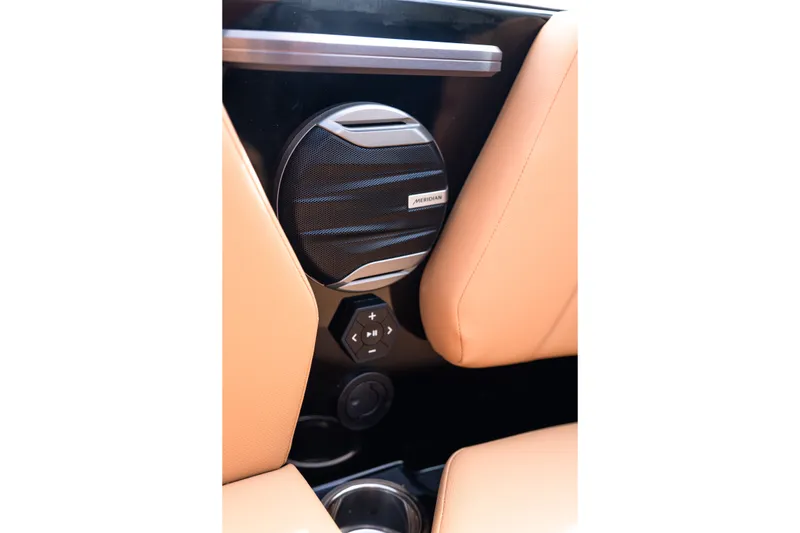 Slide: The Image of 2027 MasterCraft NXT24 boat interior with Meridian speaker and control panel. - 33