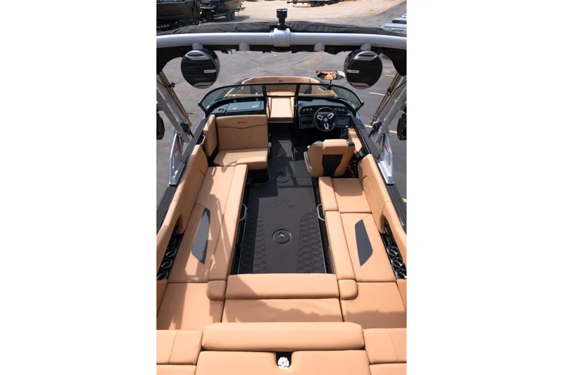 Slide: The Image of Interior view of 2027 MasterCraft NXT24 boat with tan seating and modern dashboard. - 35