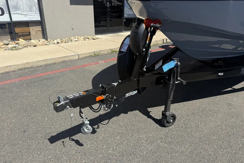 Slide: The Image of Trailer hitch of 2026 MB B52 23 Alpha boat on pavement. - 8