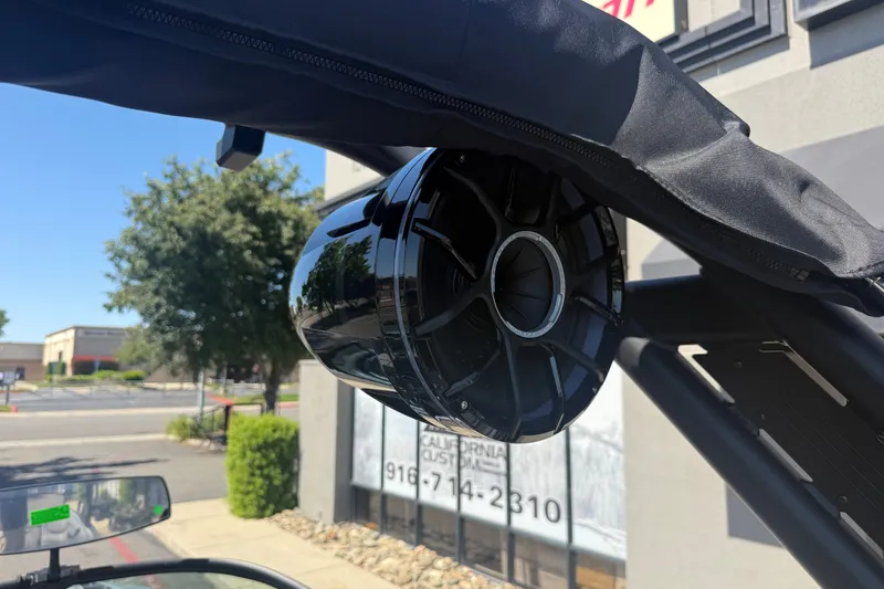 Slide: The Image of 2026 MB B52 23 Alpha boat speaker mounted on a sleek black frame outdoors. - 29